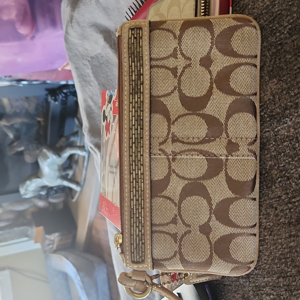 EUC Coach wristlet with pink lining